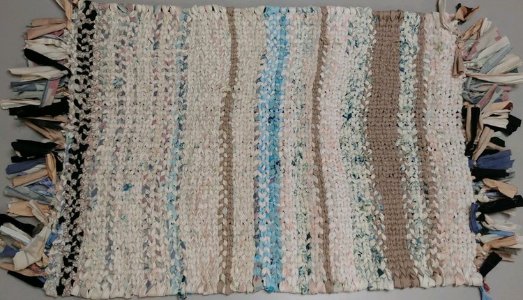 weaving rug of cream, blue, pink and brown