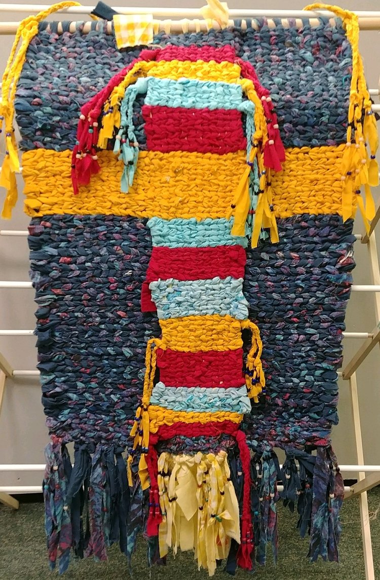 weaving rug with blue, red and gold
