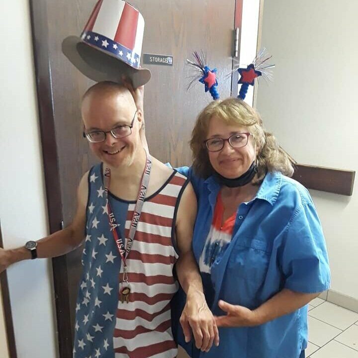 Aspire client and employee smiling wearing 4th of July attire